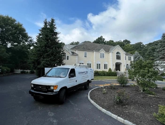 Bay Village Power Washing technician performing thorough gutter cleaning service in Bay Village