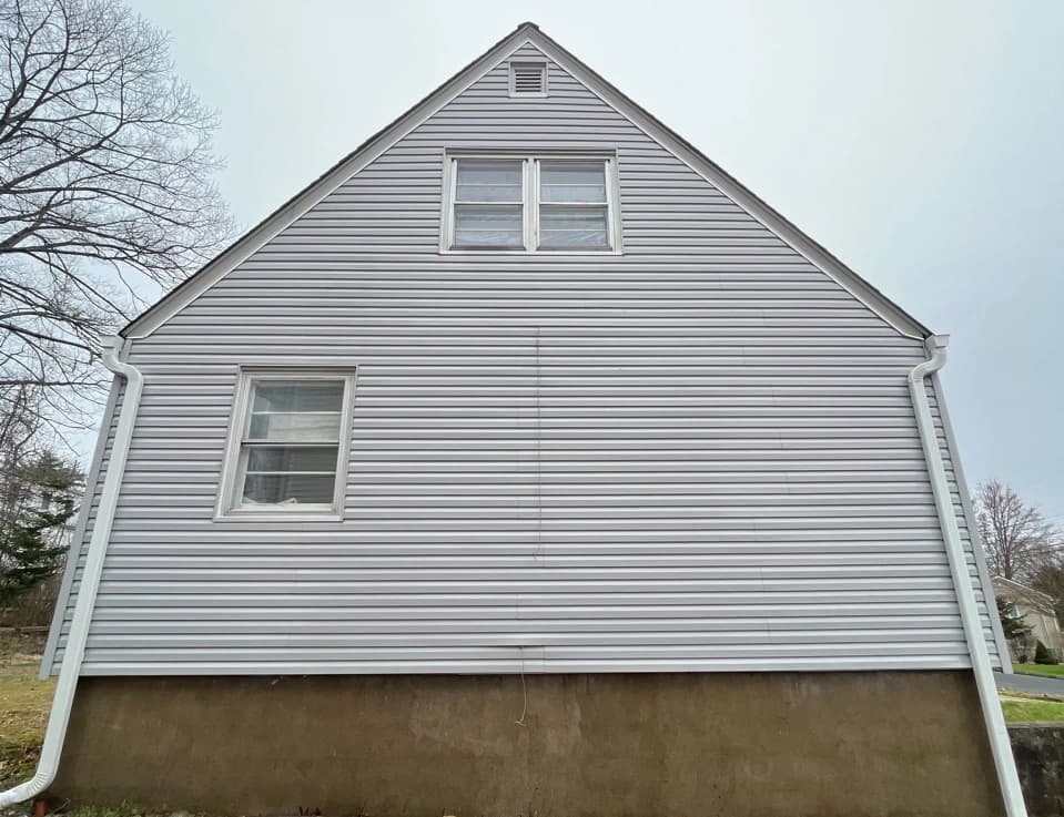 Bay Village Power Washing technician performing detailed house washing in Bay Village residential area